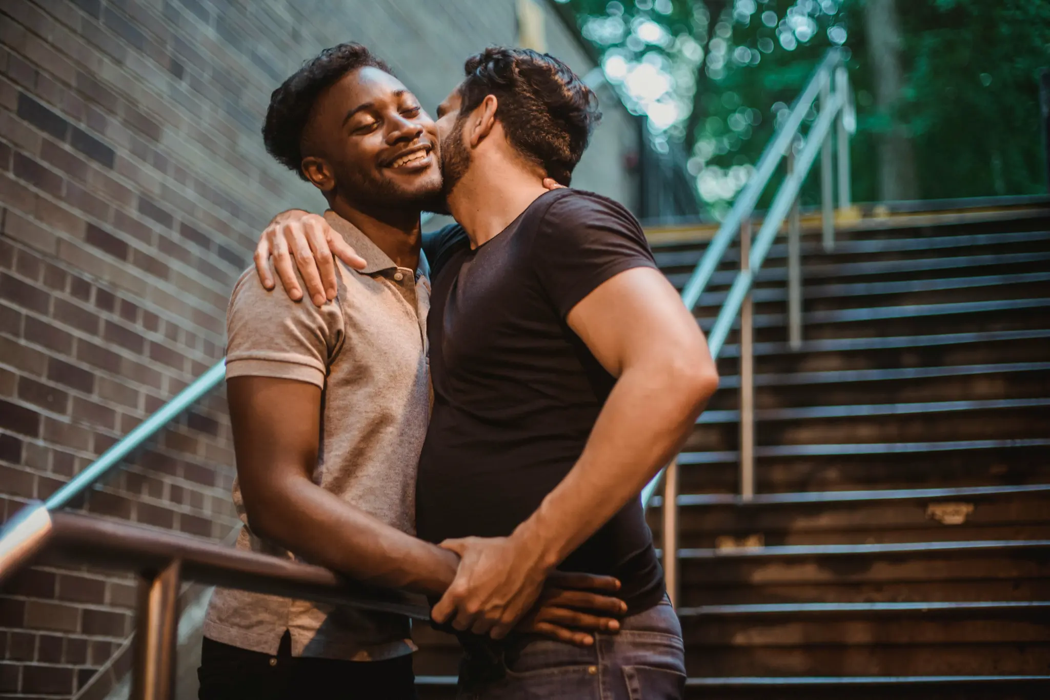 Two men embracing warmly — couples therapy
