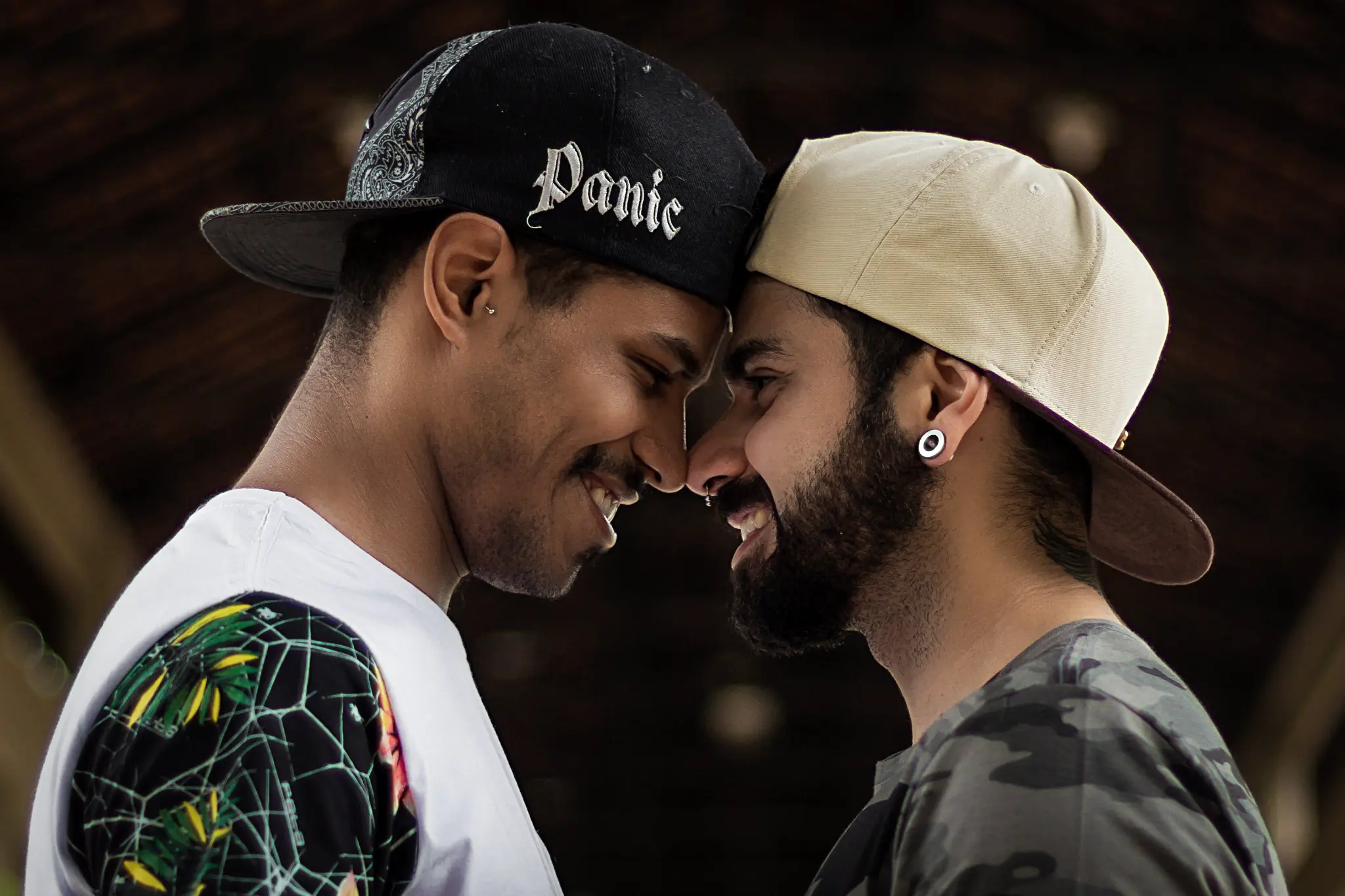 Gay couple close together, smiling and connected
