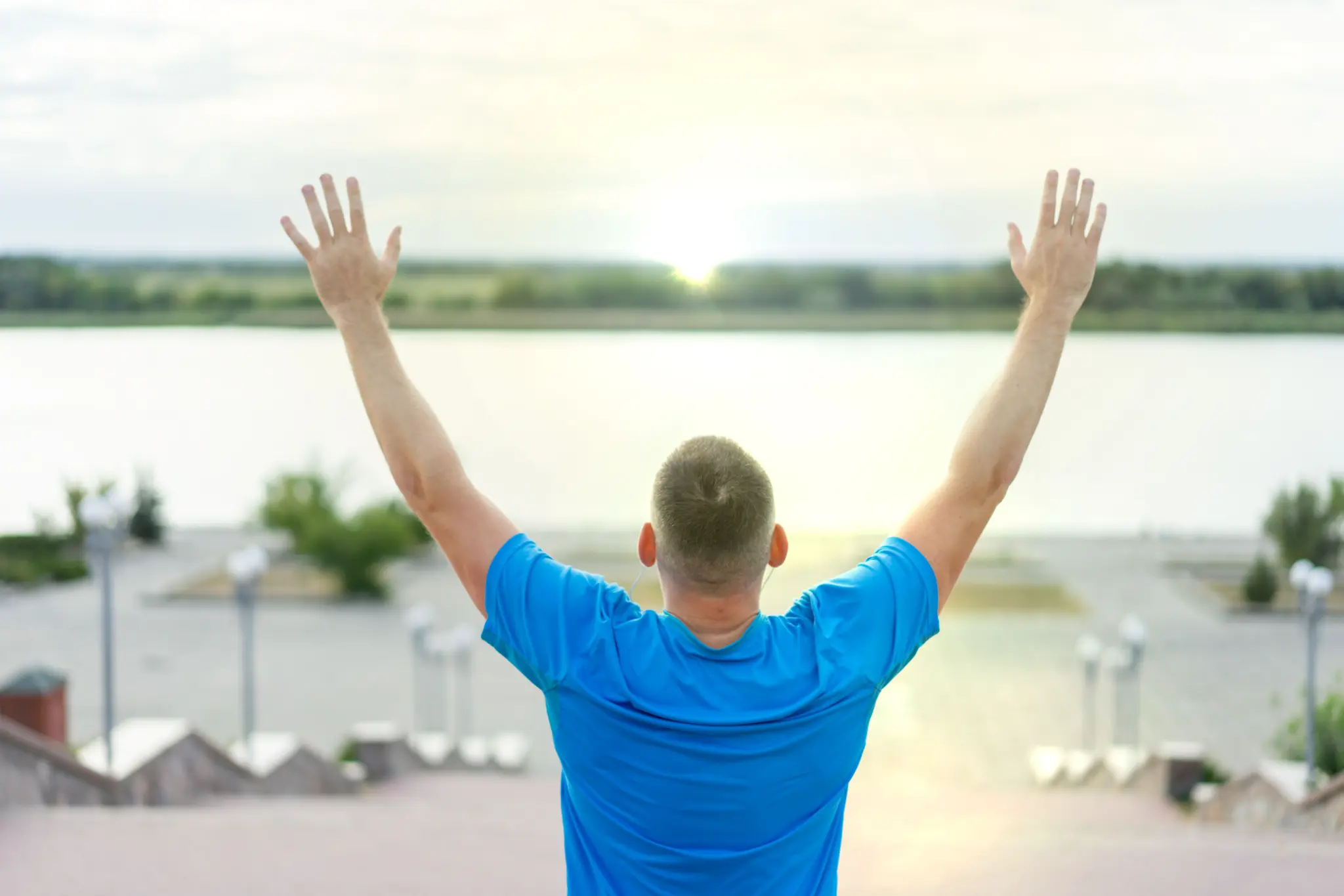 Man with arms raised in recovery — addiction counseling Los Angeles